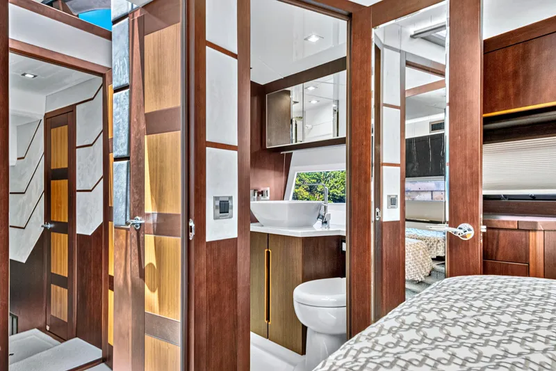 Slide: The Image of Luxurious interior of 2017 Galeon 560 Sky yacht featuring modern bathroom and elegant wood finishes. - 28