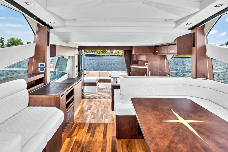 Slide: The Image of Luxurious interior of 2017 Galeon 560 Sky yacht with elegant wood and white seating. - 18