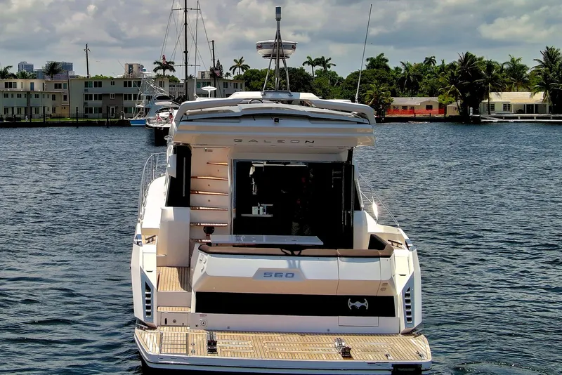 Slide: The Image of Galeon 560 Sky yacht, 2017 model, docked on a sunny waterfront. - 5