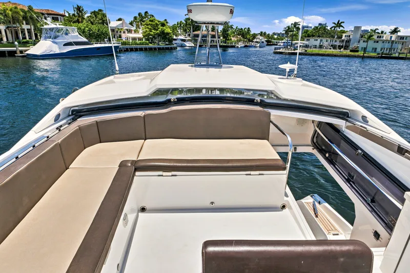 Slide: The Image of Luxurious 2017 Galeon 560 Sky yacht with spacious seating, cruising on a scenic waterway. - 11