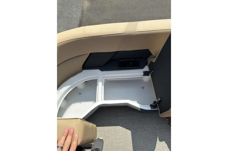 Slide: The Image of Evotti 723QL 2026 boat seat storage compartment with beige upholstery and open lid. - 16