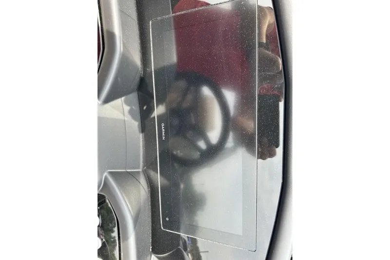 Slide: The Image of Interior of 2026 Evotti 723QL featuring a Garmin display screen. - 18