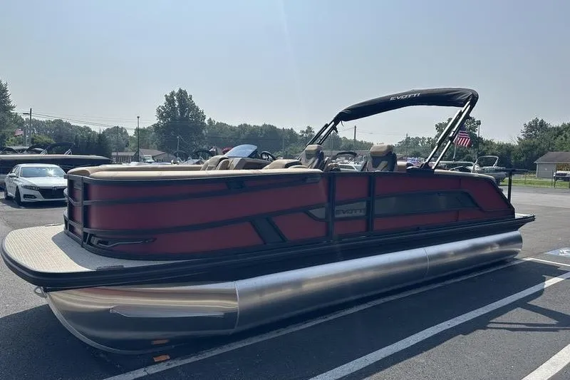 Slide: The Image of 2026 Evotti 723QL pontoon boat with sleek design, parked outdoors on a sunny day. - 15