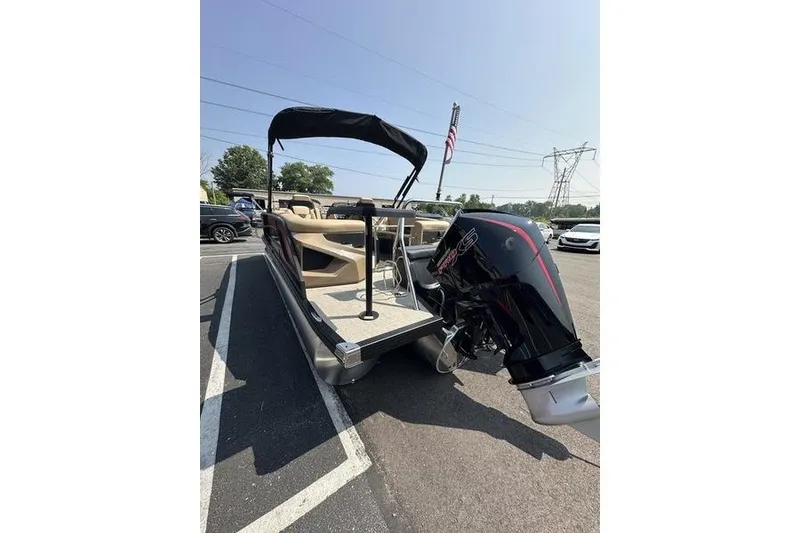 Slide: The Image of 2026 Evotti 723QL pontoon boat with outboard motor in parking lot. - 28