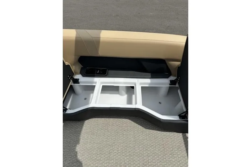 Slide: The Image of Evotti 723QL 2026 model interior storage compartment with beige and black seating. - 11