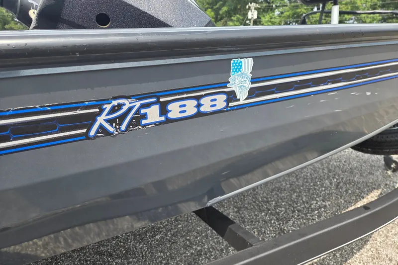 Slide: The Image of 2022 Ranger RT188 boat with blue and white graphics on the side. - 10