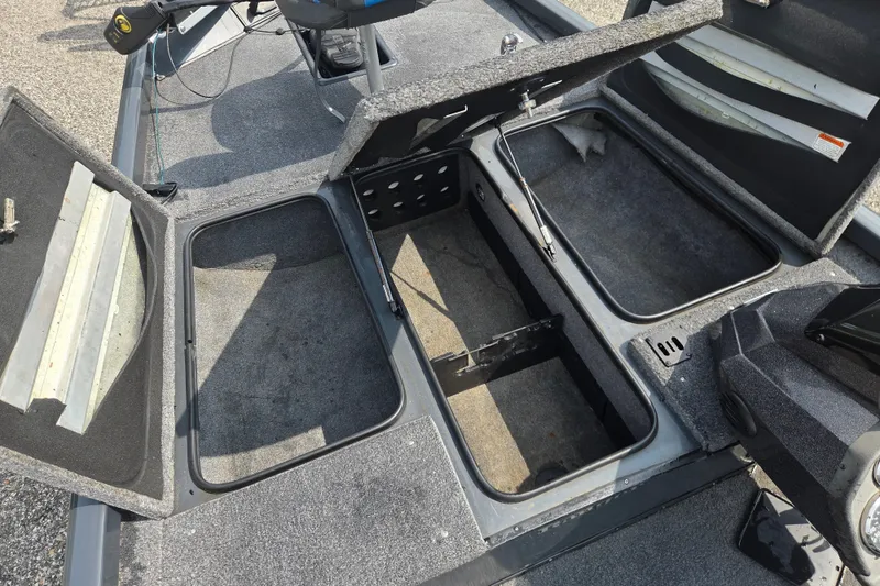 Slide: The Image of 2022 Ranger RT188 boat storage compartments open, showcasing spacious interior design. - 12