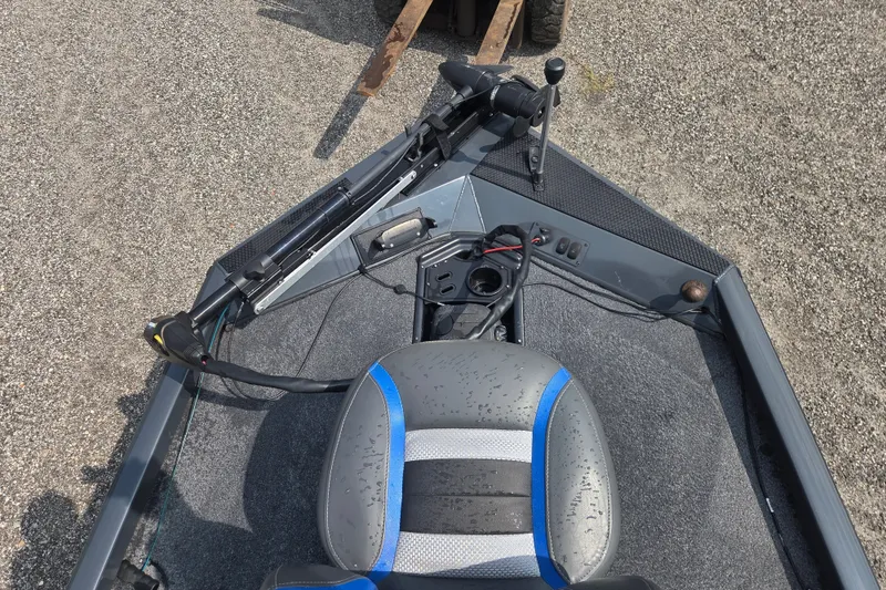 Slide: The Image of 2022 Ranger RT188 boat interior with steering console and seat, featuring modern design elements. - 14