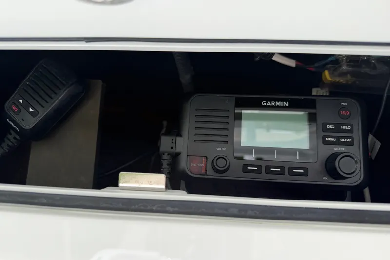 Slide: The Image of Garmin marine radio system inside 2024 Contender 25 Bay boat console. - 40