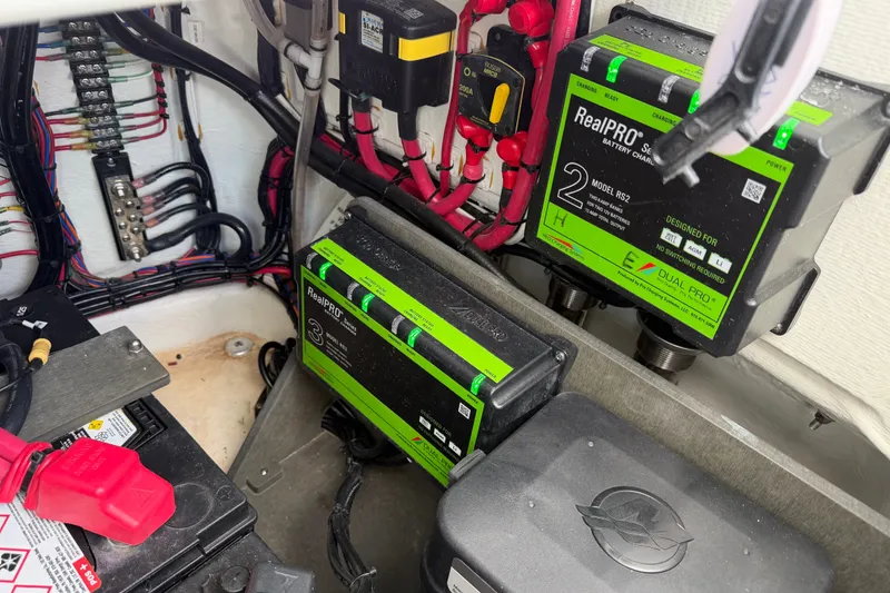 Slide: The Image of Electrical system of a 2024 Contender 25 Bay boat with battery chargers and wiring. - 42