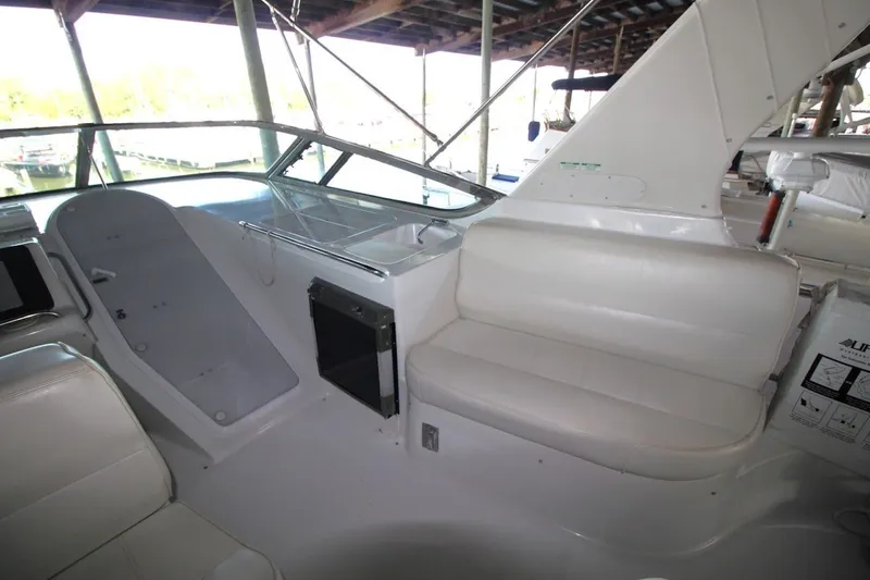 Slide: The Image of Interior view of 2000 Carver 530 Voyager Pilothouse with seating and helm area. - 15