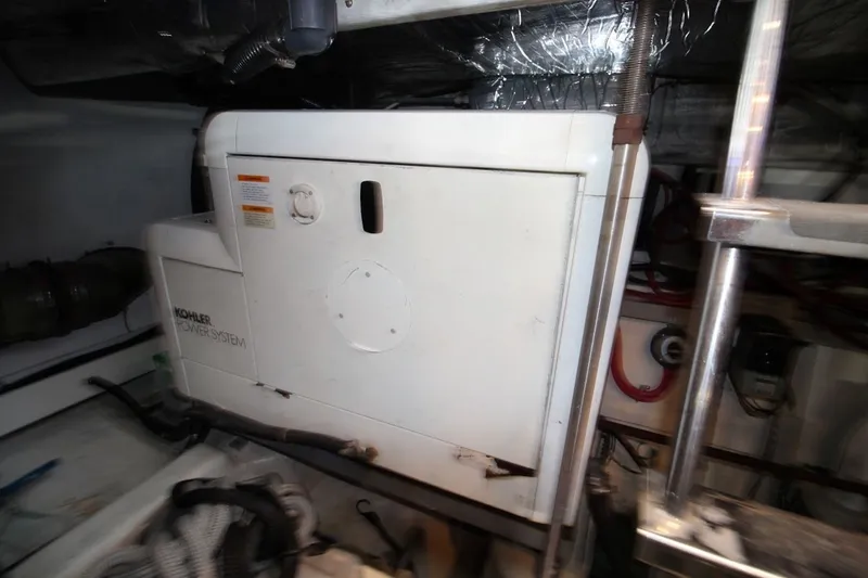 Slide: The Image of Kohler power system in 2000 Carver 530 Voyager Pilothouse engine room. - 43