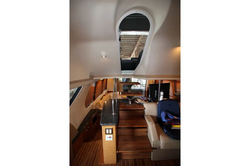 Slide: The Image of Interior view of 2000 Carver 530 Voyager Pilothouse with wooden stairs and modern design. - 26