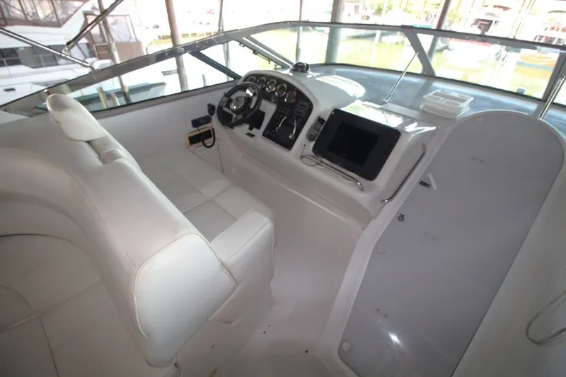 Slide: The Image of Interior of 2000 Carver 530 Voyager Pilothouse with helm and seating area. - 16