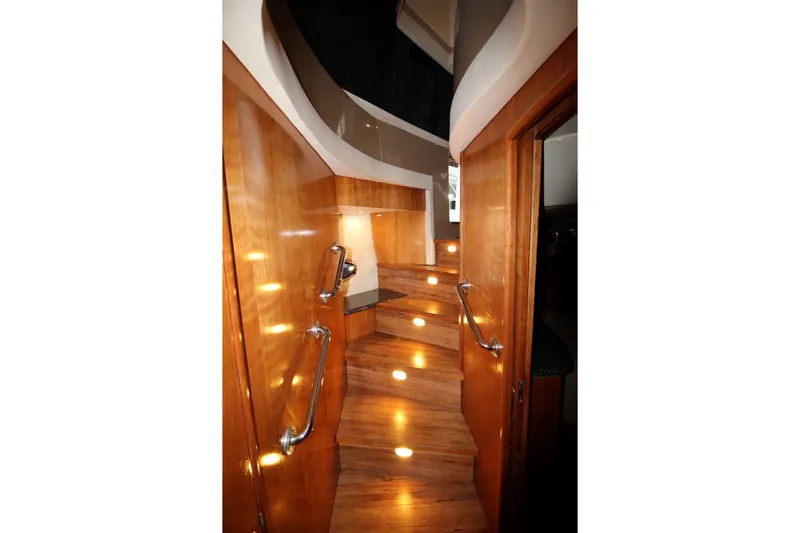 Slide: The Image of Interior view of 2000 Carver 530 Voyager Pilothouse with illuminated wooden staircase. - 28