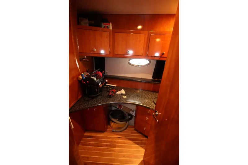 Slide: The Image of Interior of 2000 Carver 530 Voyager Pilothouse with wooden cabinets and countertop. - 35