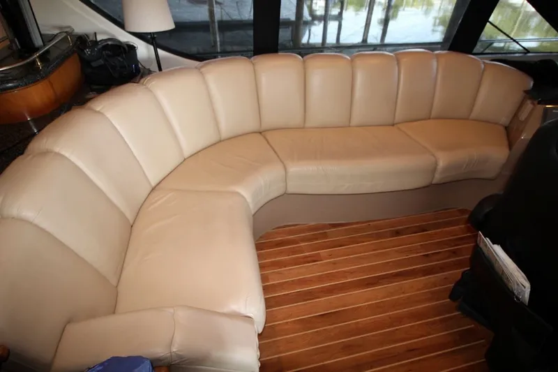 Slide: The Image of Luxurious beige leather seating in 2000 Carver 530 Voyager Pilothouse yacht interior. - 25