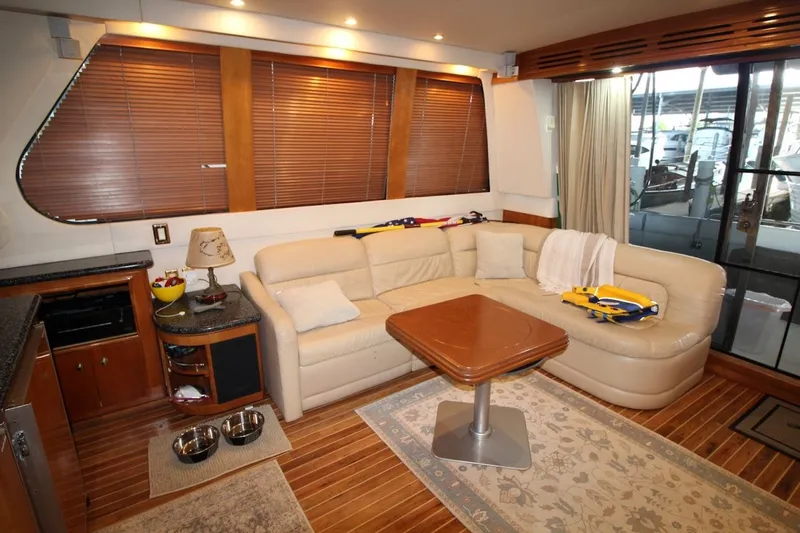 Slide: The Image of Luxurious interior of 2000 Carver 530 Voyager Pilothouse with leather seating and wooden accents. - 19