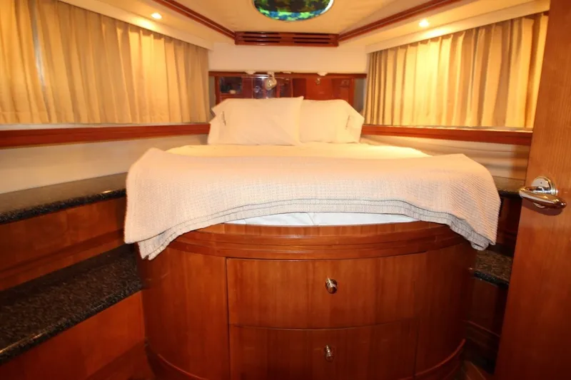 Slide: The Image of Luxurious bedroom interior of 2000 Carver 530 Voyager Pilothouse yacht with cozy bedding. - 36