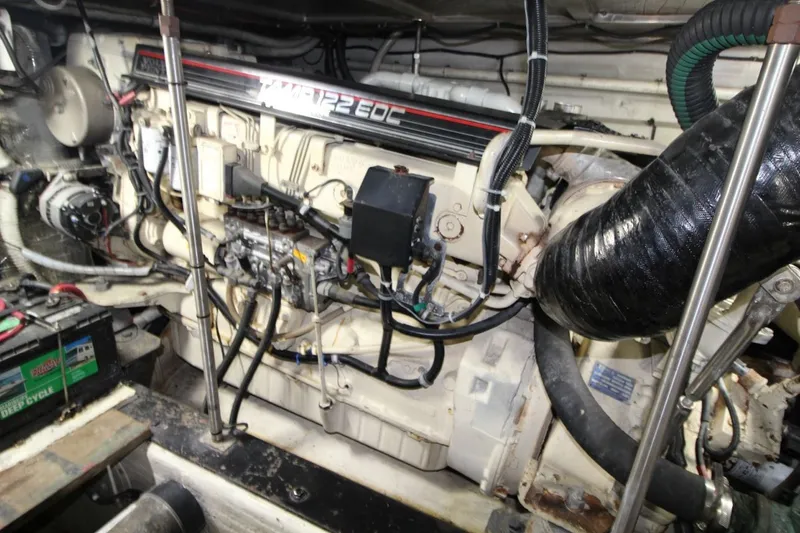 Slide: The Image of Engine room of a 2000 Carver 530 Voyager Pilothouse with detailed mechanical components. - 40