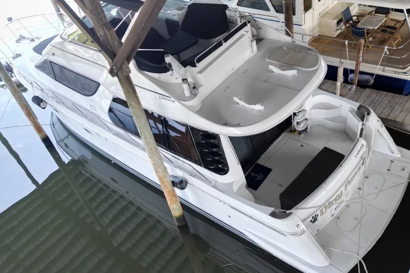 Slide: The Image of 2000 Carver 530 Voyager Pilothouse yacht docked in marina, aerial view. - 6