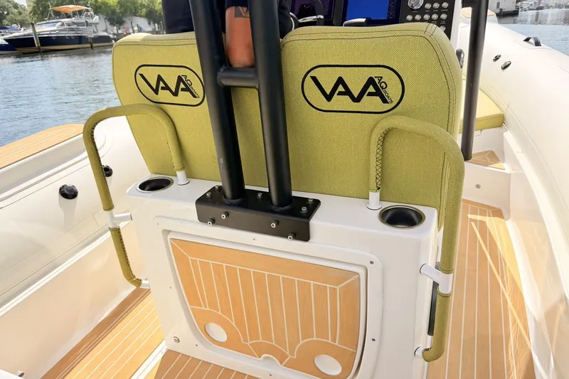 Slide: The Image of Aqvaboats Luxrib 25, 2027 model, featuring stylish seating and modern design on a sunny day. - 12