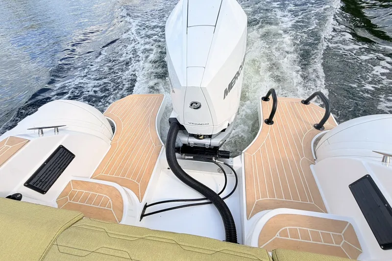Slide: The Image of Aqvaboats Luxrib 25, 2027 model, features a powerful outboard motor on water. - 31