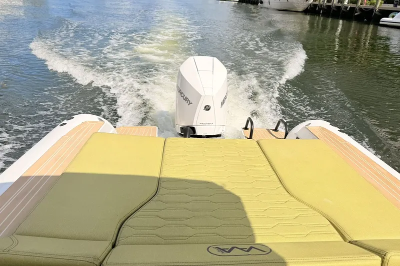 Slide: The Image of Aqvaboats Luxrib 25 (2027) cruising on water, rear view with motor and wake. - 30