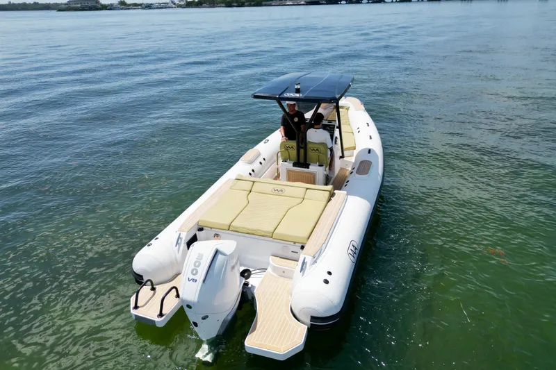 Slide: The Image of Aqvaboats Luxrib 25, 2027 model, cruising on calm waters with sleek design and powerful engine. - 15
