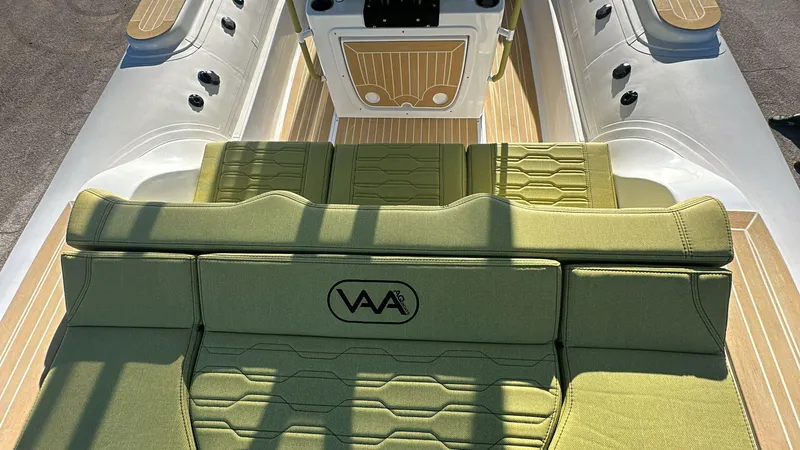 Slide: The Image of Aqvaboats Luxrib 25, 2025 model, featuring green seating and sleek design. - 23