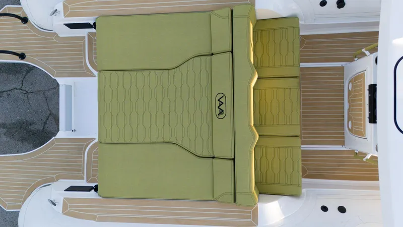Slide: The Image of Aqvaboats Luxrib 25, 2025 model, featuring green cushioned seating and teak-style flooring. - 18