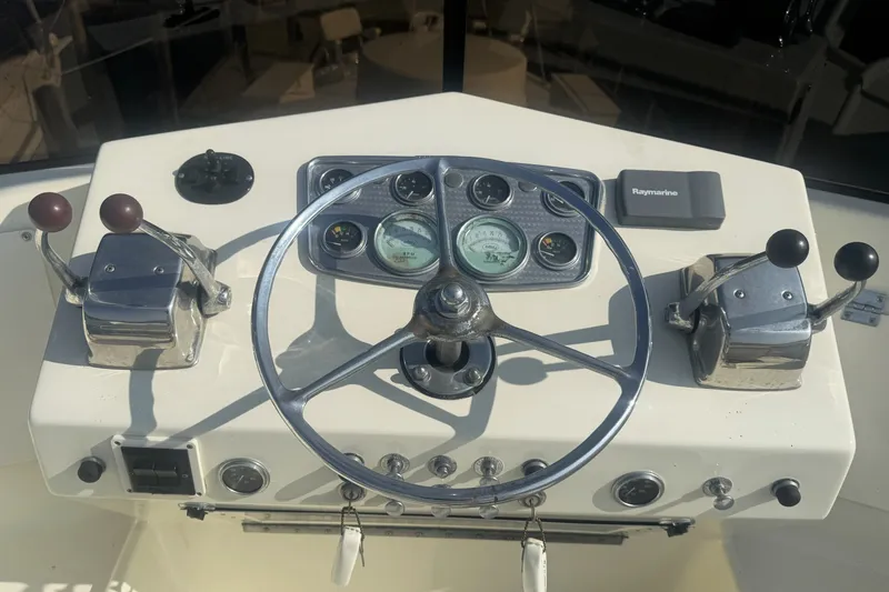 Slide: The Image of Helm of 1967 Hatteras 43 Motor Yacht with steering wheel and controls. - 9