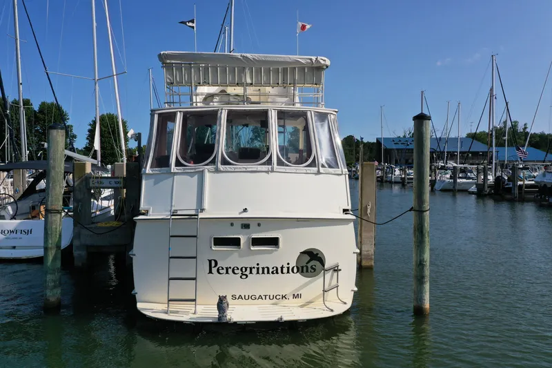 Slide: The Image of 1967 Hatteras 43 Motor Yacht docked in Saugatuck marina, rear view. - 4