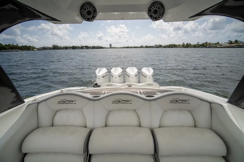 Slide: The Image of Luxury MTI V42 boat interior with four powerful engines on a sunny day. - 8