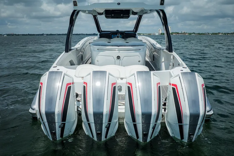 Slide: The Image of 2020 MTI V42 boat with four powerful outboard engines on open water. - 5
