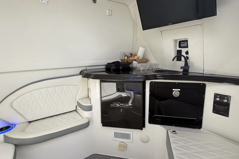 Slide: The Image of Luxurious MTI V42 yacht interior with modern kitchenette and seating, 2020 model. - 14