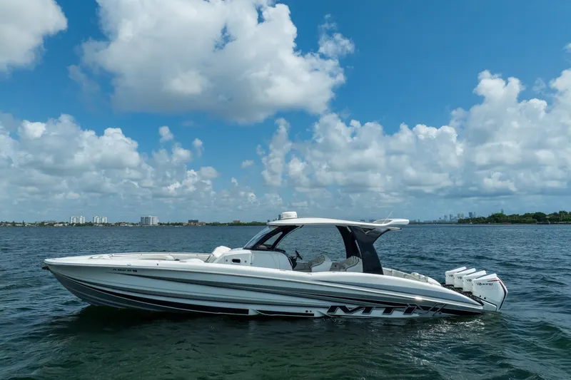 Slide: The Image of MTI V42 2020 boat on water under blue sky with clouds. - 3