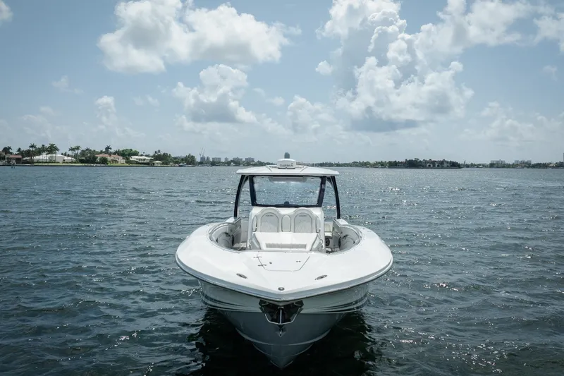 Slide: The Image of Front view of a 2020 MTI V42 boat on a sunny day. - 16