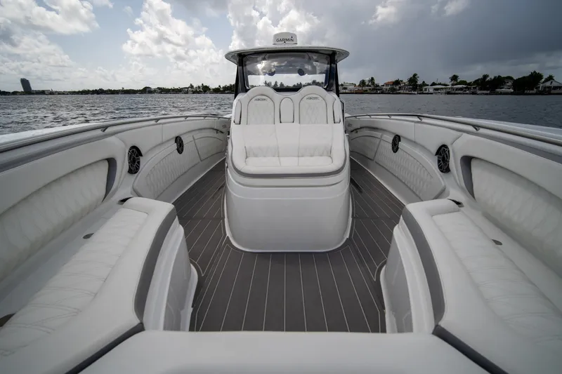 Slide: The Image of Luxurious 2020 MTI V42 boat interior with plush seating and sleek design on open water. - 10