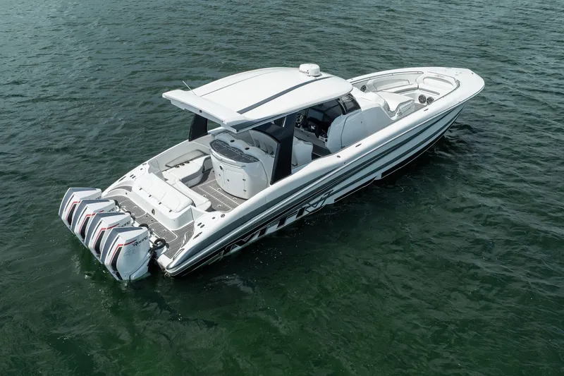 Slide: The Image of 2020 MTI V42 boat with four engines on open water. - 1