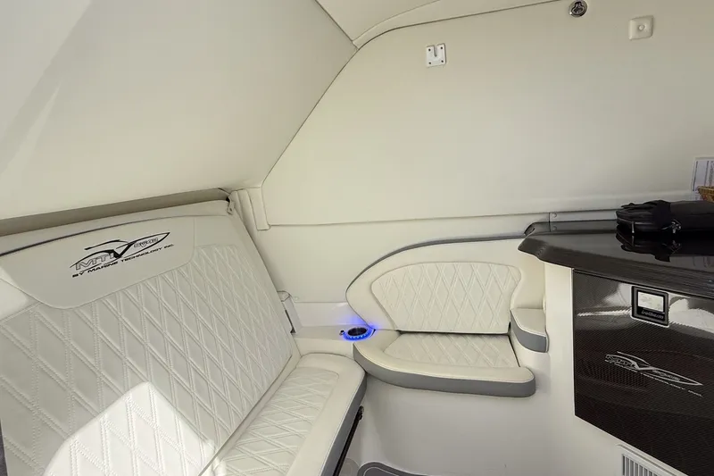 Slide: The Image of Luxurious interior of 2020 MTI V42 boat with white leather seating and sleek design. - 13