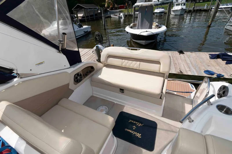 Slide: The Image of Interior of a 2020 Regal 2860 Window Express boat with beige seating. - 6