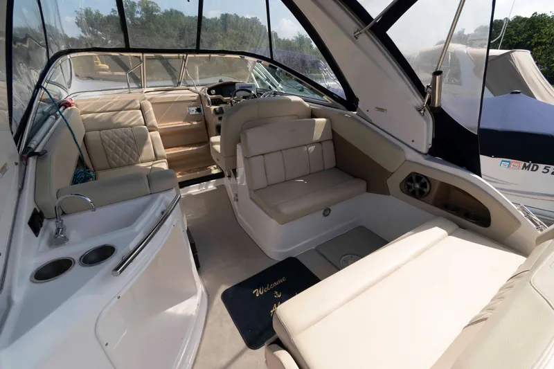 Slide: The Image of Interior of a 2020 Regal 2860 Window Express boat with beige seating and helm. - 4