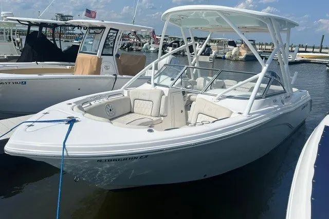 The Image of 2020 Sea Fox 226 Traveler boat docked in a marina under a clear sky. - 0