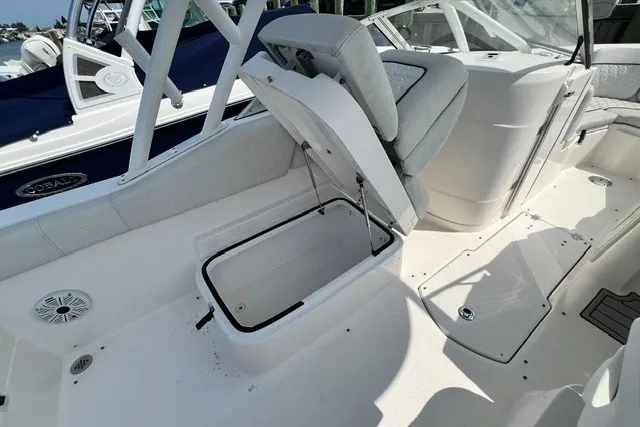 Slide: The Image of 2020 Sea Fox 226 Traveler boat interior with open storage compartment and seating. - 7