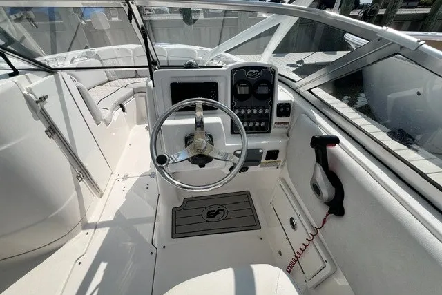 Slide: The Image of 2020 Sea Fox 226 Traveler boat cockpit with steering wheel and control panel. - 3