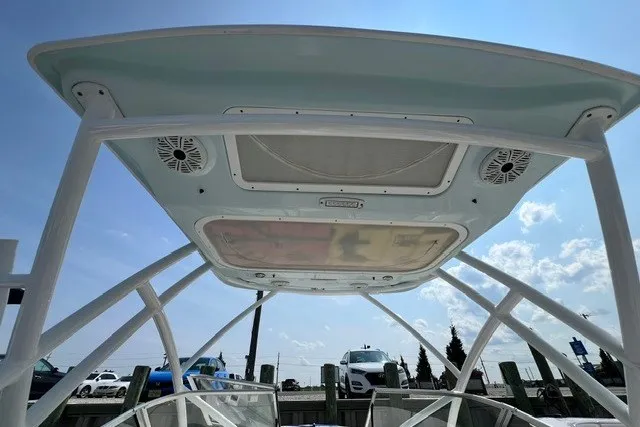 Slide: The Image of 2020 Sea Fox 226 Traveler boat canopy with speakers, viewed from below, against a clear sky. - 9