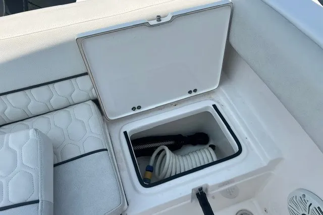 Slide: The Image of Storage compartment on a 2020 Sea Fox 226 Traveler boat with coiled rope and accessories. - 10