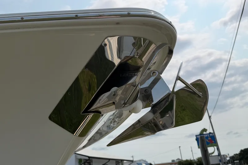Slide: The Image of 2024 Sea Hunt Ultra 275 SE boat anchor detail against cloudy sky. - 15