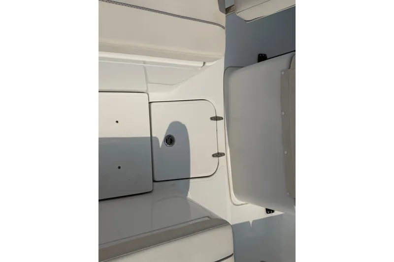 Slide: The Image of 2024 Sea Hunt Ultra 275 SE boat interior with storage compartments and seating. - 31